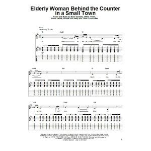 Elderly Woman Behind The Counter In A Small Town