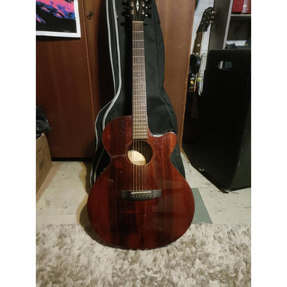 The Cort Myrtlewood SFX is a stunning acoustic-electric guitar with a unique tonewood construction. It features a solid Myrtlewo