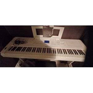 Yamaha DGX-660 is a versatile digital piano that combines high-quality sound with an extensive range of features. With its weigh
