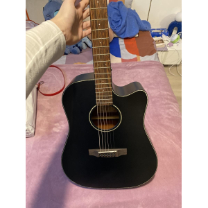 Black electro-acoustic guitar by Cort.