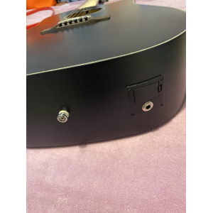 Black electro-acoustic guitar by Cort.