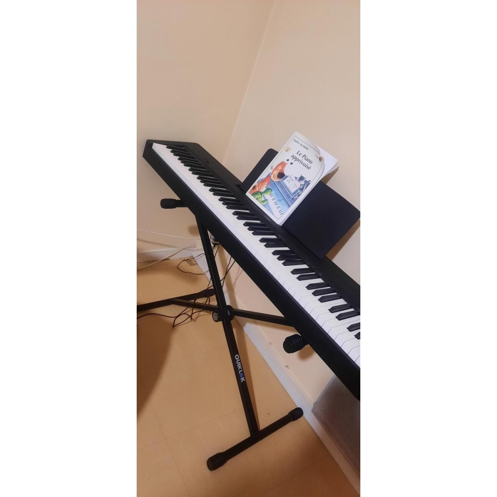 Yamaha P-145B with stand and learning book