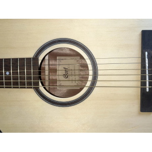 The Cort AF550 OP is a high-quality acoustic guitar that delivers exceptional sound and playability. With its solid spruce top a